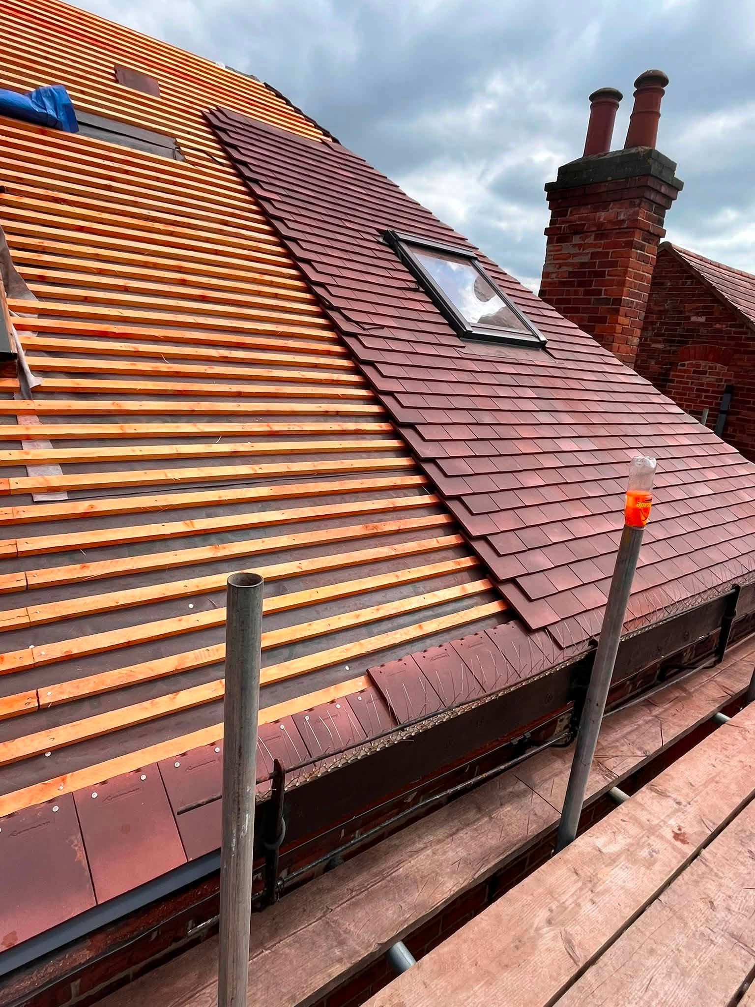 Roofing project in progress by K. Wright Roofing Services