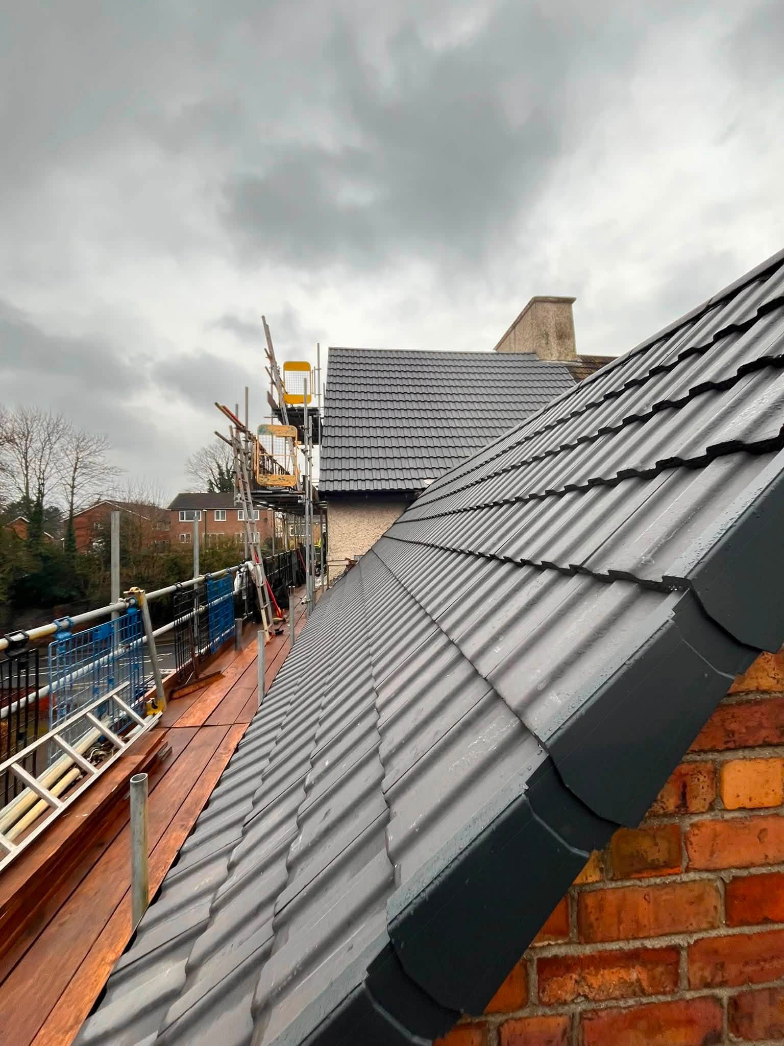 Completed tiled roofing project by K. Wright Roofing Services
