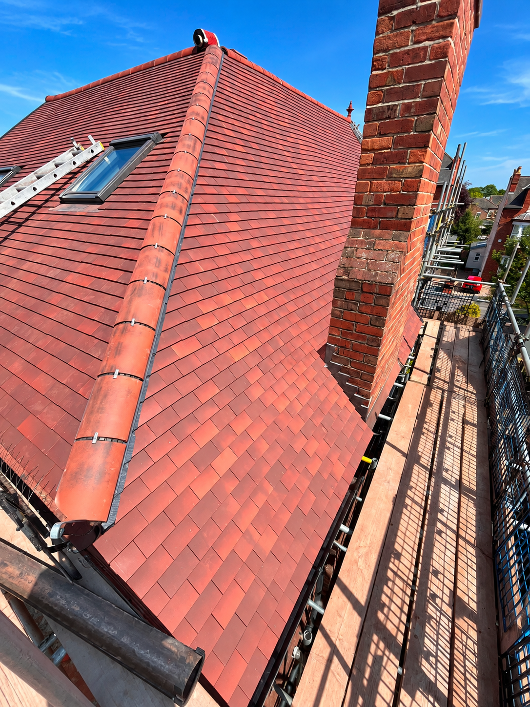 Red tiled roof project completed by K. Wright Roofing Services